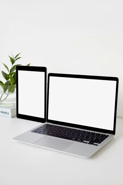 Laptop on a desk displaying the Pexels homepage, emphasizing its web interface.